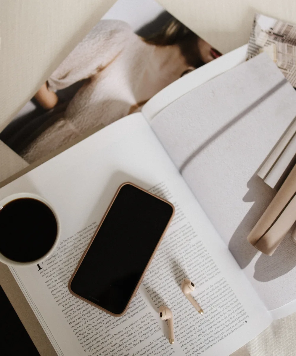 Notebook and laptop on a desk — planning website copy goals for your service business