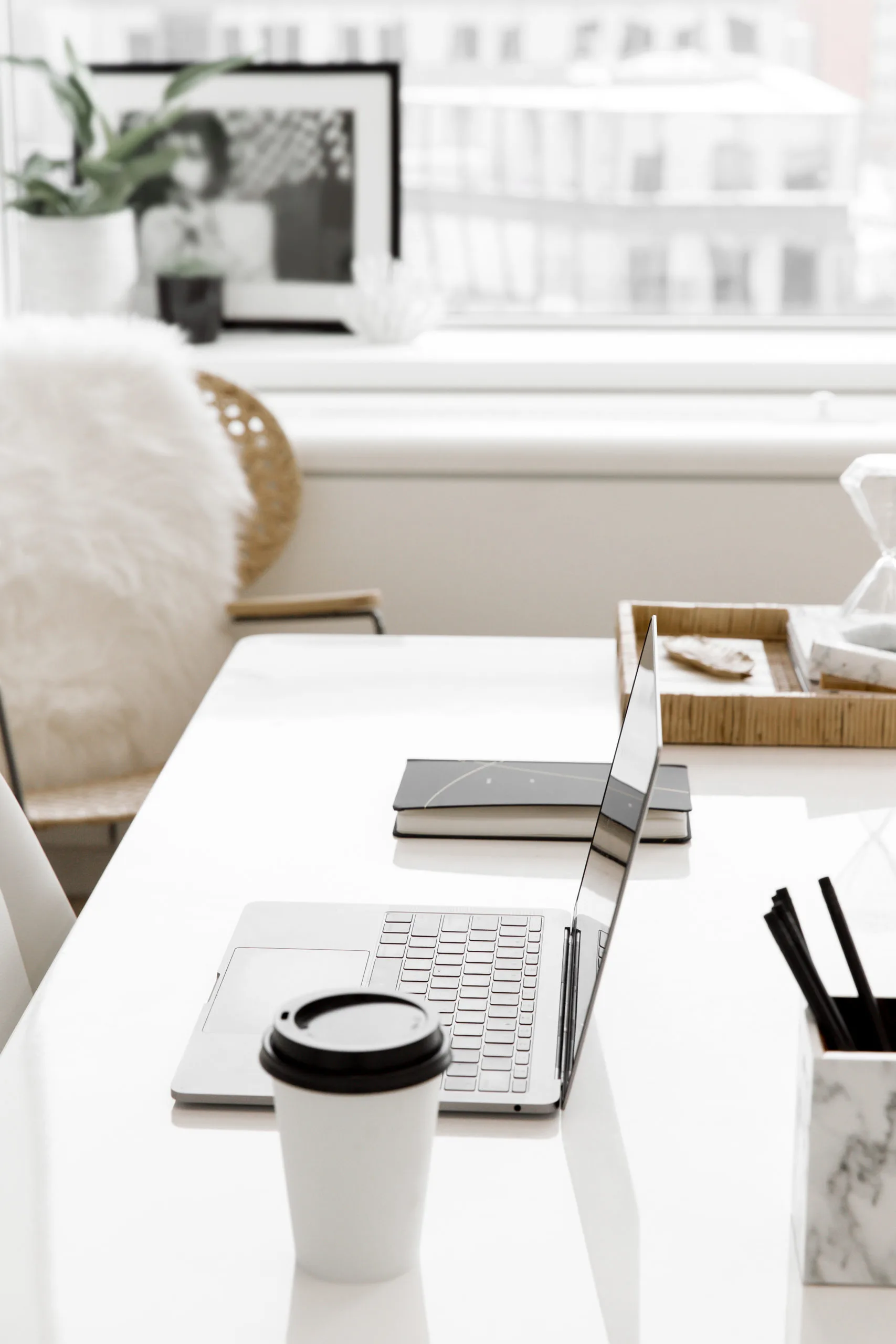 Online service provider working at a bright desk — website copywriting course created for service providers